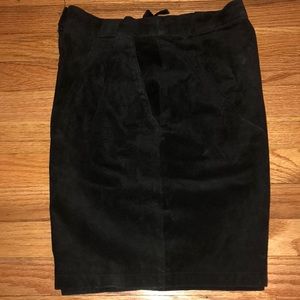 Black suede leather shorts.